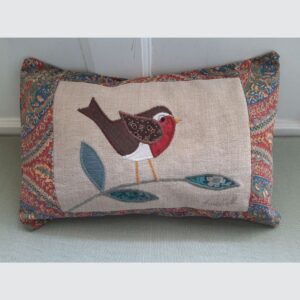 The Sussex Guild Robin cushion in green and red  1