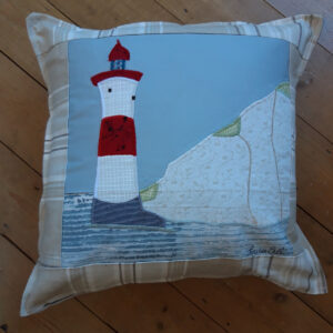 The Sussex Guild Seaside Lighthouse cushion
