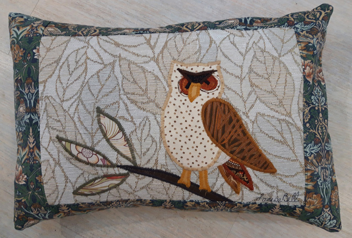 The Sussex Guild Owl cushion in blue green Louise Bell