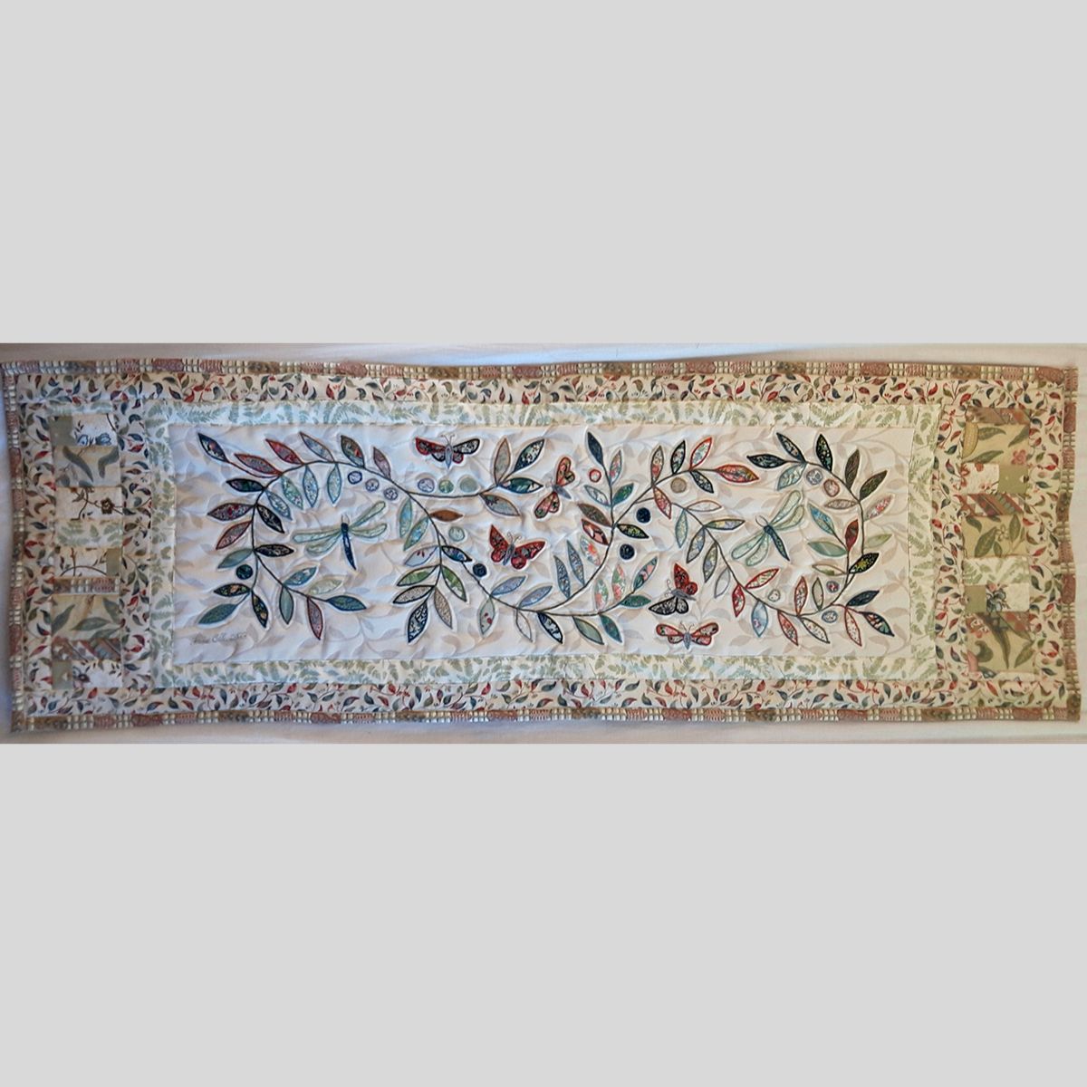The Sussex Guild Butterfly Bed Runner in pale green Louise Bell