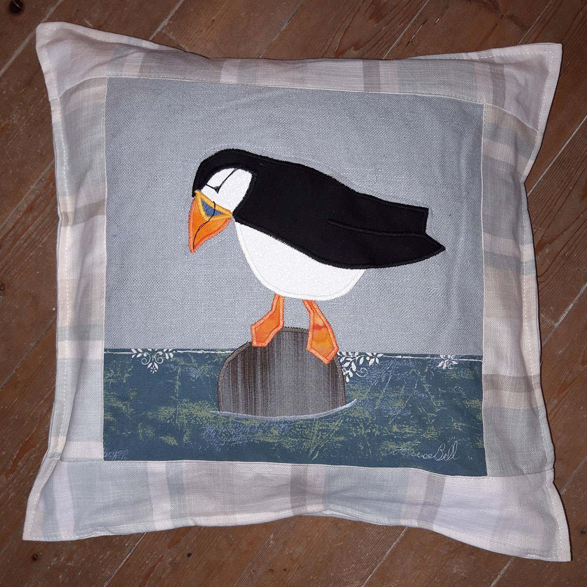 The Sussex Guild Puffin cushion