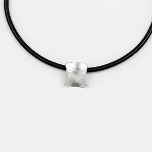 The Sussex Guild Shield-shaped pendant on rubber choker 1