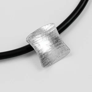 The Sussex Guild Shield-shaped pendant on rubber choker