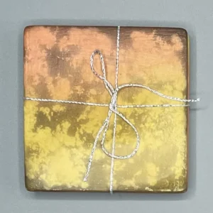 A set of 2 Peach and Yellow Square Ceramic Coasters.